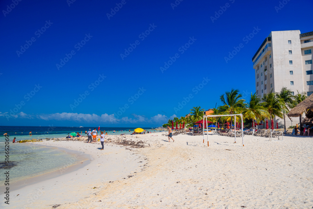 Hotel on the sandy beach on a sunny day in Cancun, Yukatan, Mexico