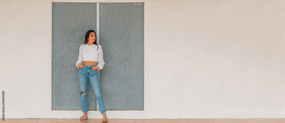 latin girl standing in the street full length with copy-space latin girl standing in the street full length with copy-space