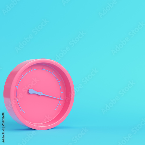 Pink gauge on bright blue background in pastel colors. Minimalism concept