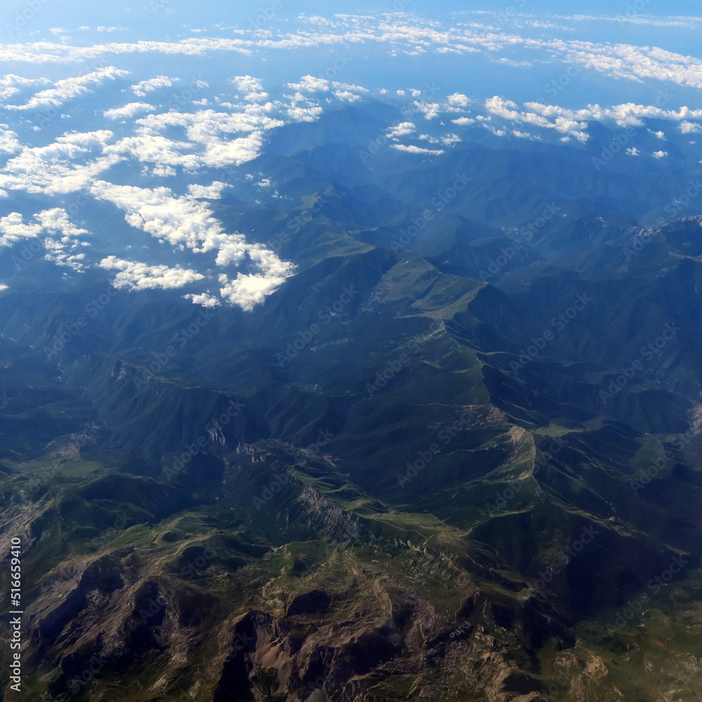 Beautiful mountain range seen from the airplane Beautiful mountain range seen from the airplane
