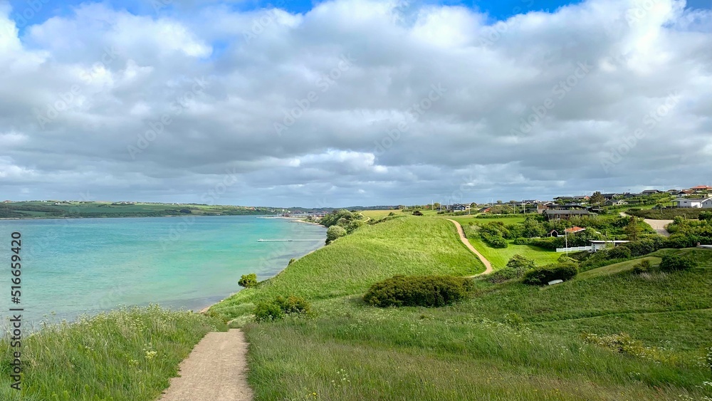 hiking trail along the hilly coast of the Limfjord near Lemvig overlooking the water, hiking, travel, Denmark, Jutland