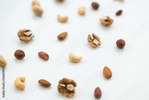 Pattern of nuts mix. Cashew, peanut, hazelnuts, walnuts, almonds on white background