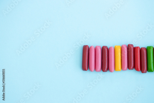 Candy colored sticks on blue background