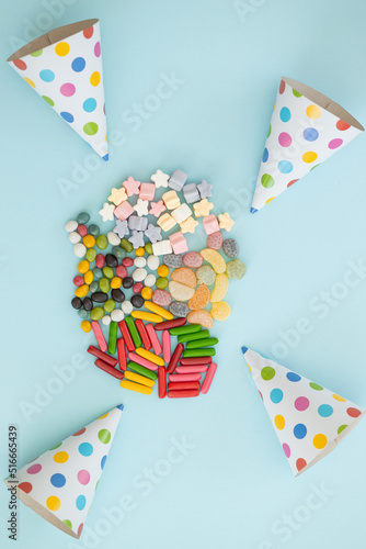 many different candies, sweets on blue background