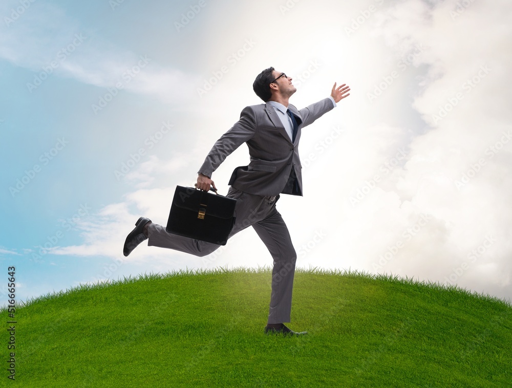 Happy businessman running towards his goal Happy businessman running towards his goal