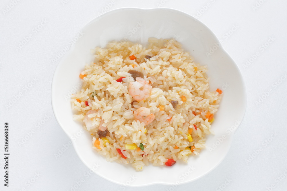 Asian food, shrimp and vegetable fried rice on white plate with copy space Asian food, shrimp and vegetable fried rice on white plate with copy space