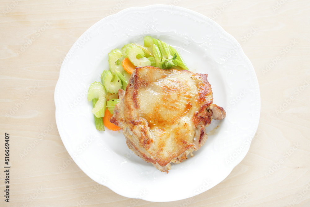 Homemade grilled chicken tight meat served with celery and carrot Homemade grilled chicken tight meat served with celery and carrot