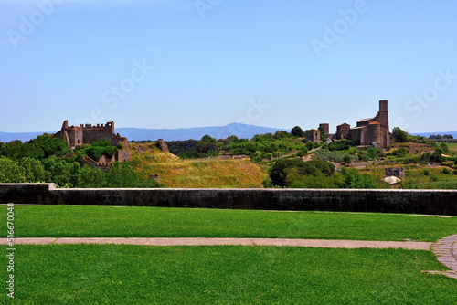 the castle of the rivellino and the basilica san pietro Tuscania Italy