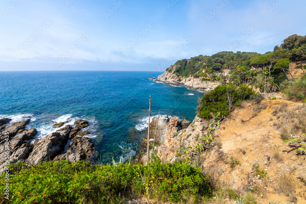View of the Mediterranean sea and coast of Costa Brava from the Cala Banys nature walk trail and gardens at the town of Lloret de Mar, Spain.