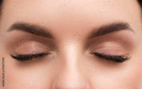 Close up of woman eye with beautiful nude eyes makeup.