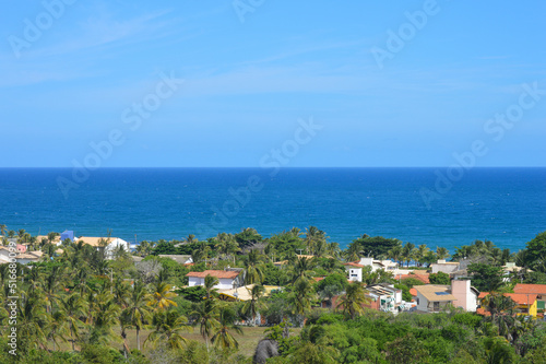 Landscape of a blue ocean and green trees at Salvador