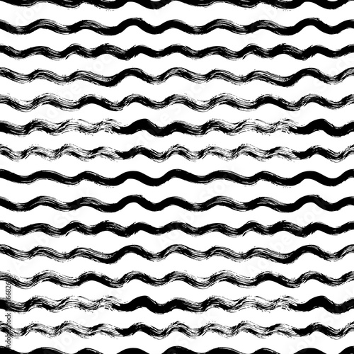 Abstract seamless hand drawn wavy pattern. Black and white curved brush strokes, wavy lines with scribbles and scuffs. Vector ink illustration. Design for backdrops with sea, rivers or water texture