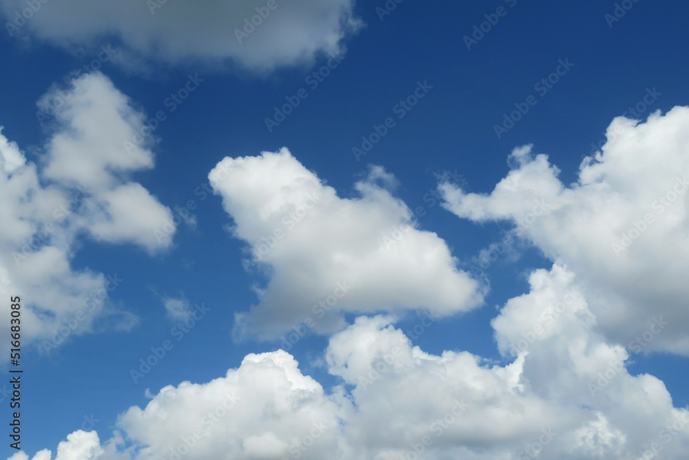 Fototapeta premium Beautiful shaped clouds in blue sky, natural cloudscape
