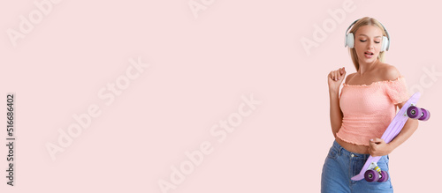Cool young woman with skateboard listening to music and dancing against pink background with space for text © Pixel-Shot