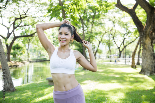 Asian lady exercise outdoors © Supasin
