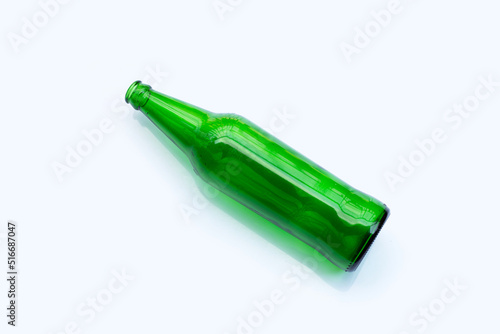 Green glass bottle isolated on white background.