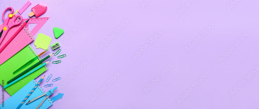 Fototapeta premium Many school stationery on lilac background with space for text, top view
