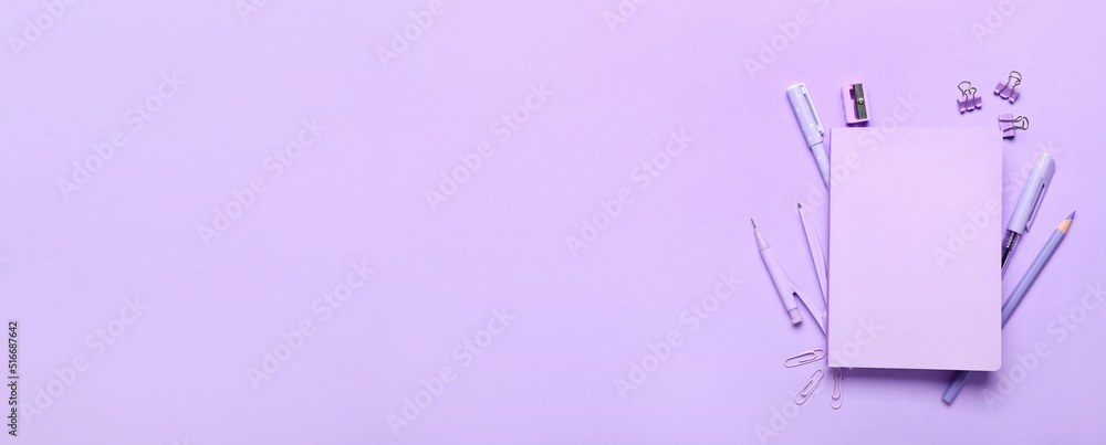 Fototapeta premium School stationery on lilac background with space for text, top view
