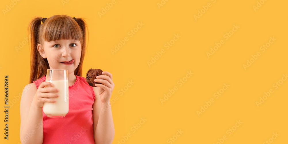 Cute little girl drinking milk and eating tasty cookie on yellow background with space for text