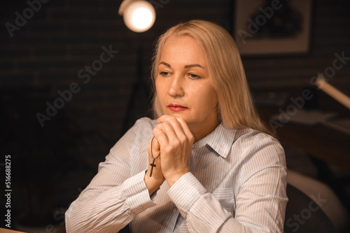 Religious mature woman pray...