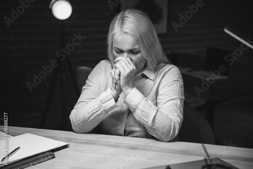 Praying mature woman with c...