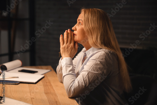 Religious mature woman pray...
