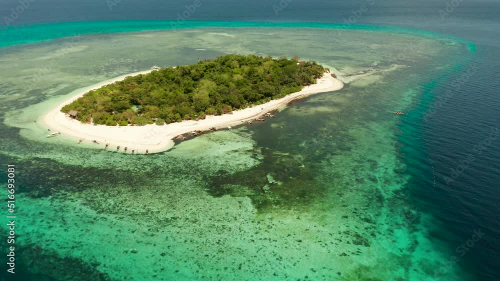 Tropical island and sandy beach surrounded by atoll coral reef and blue sea, aerial view. Small island with sandy beach. Summer and travel vacation concept, Mantigue Philippines Mindanao Tropical island and sandy beach surrounded by atoll coral reef and blue sea, aerial view. Small island with sandy beach. Summer and travel vacation concept, Mantigue Philippines Mindanao