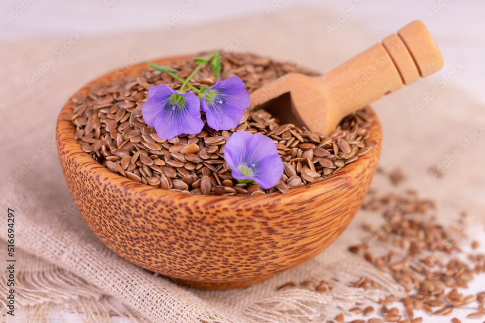 Flax seeds in a wooden bowl. Close-up.
Flax seeds in a wooden bowl. Close-up.