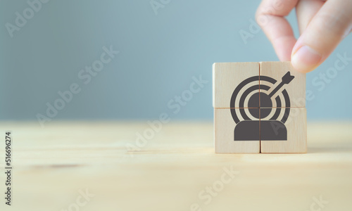 Target customer, buyer persona, marketing segmentation, job recruitment concept. Personalization marketing, customer centric strategies. Wooden cubes with target customer icon on smart background.