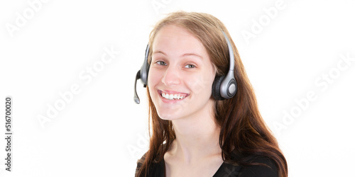 young pretty happy smiling woman works in a call center on the phone with her telephone headset