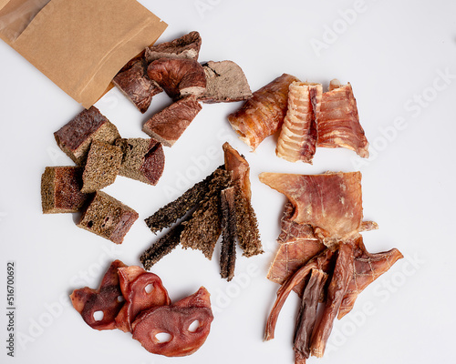 Natural dried treats for dogs. Treats for rewarding and training dogs. Dried meat products for dogs. Animal care.Selective focus. Advertisement for dog treats.