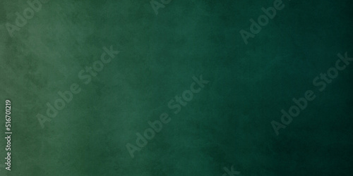 Green blackboard Soft green backdrop background with grunge texture, watercolor painted mottled green background. Green abstract grunge texture panoramic background. © MdLothfor