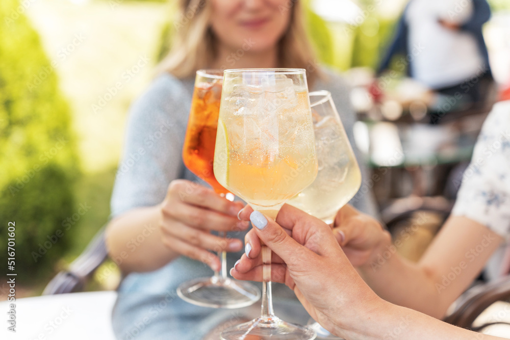 Group of happy people clinking and toasting together with friendship and happiness Group of happy people clinking and toasting together with friendship and happiness