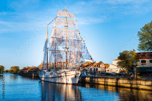 Beautiful old ship Meridian at sunset evening,blue calm sky,blue water.Symbol and landmark of Klaipeda city. photo