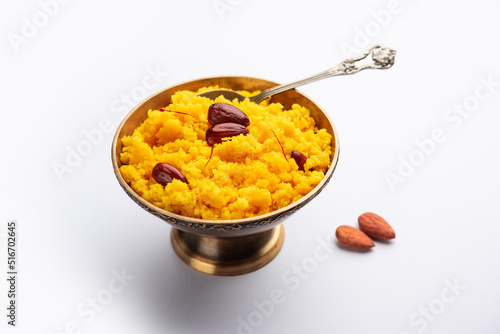 Badam Halwa or sheera also known as Almond Halwa is a traditional Indian sweet dish prepared blending milk and almonds photo