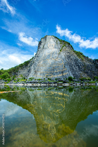 Carving Buddha Images on the moutain at Khao Chee Chan, Pattaya, Thailand.