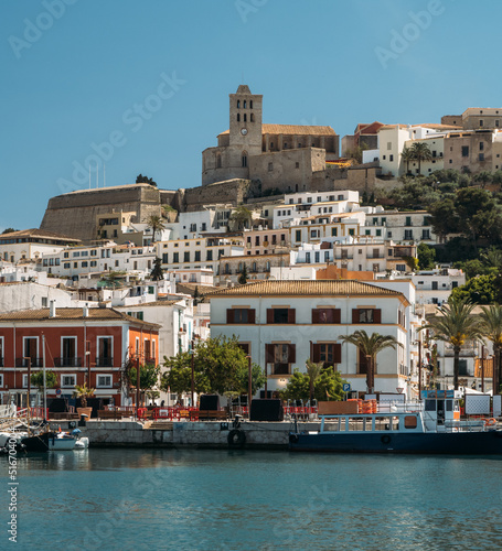 Port, old town and Castle of Ibiza. Sa Marina neighborhood and the historic complex of Dalt vila with blue sky and sea. photo