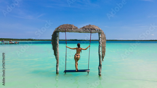 woman sees the lagoon and a cenote