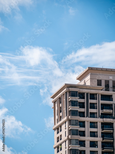 high buildings with cloudy blue sky