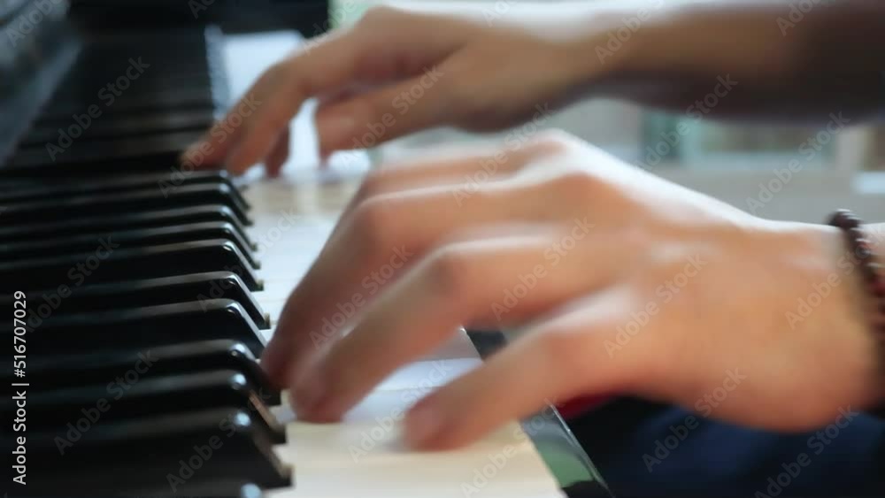 Close up of woman hands playing the piano. Close up of woman hands playing the piano.