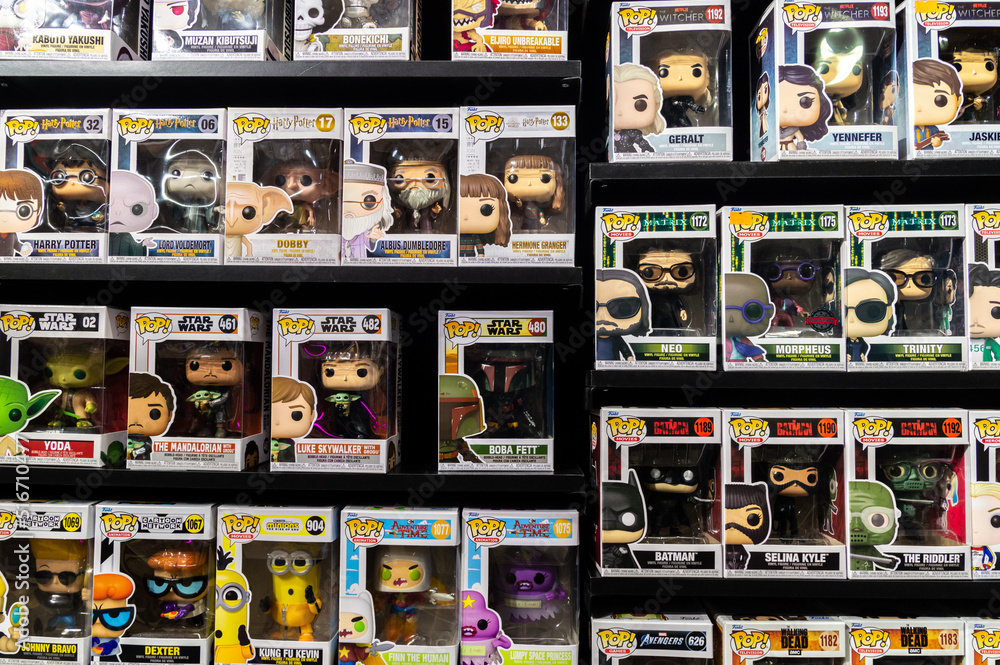Obraz premium a shelf with lots of superhero toys in boxes. Funko pops
