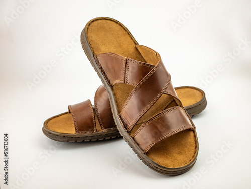 Summer shoes for males. Two brown leather fashion sandals.