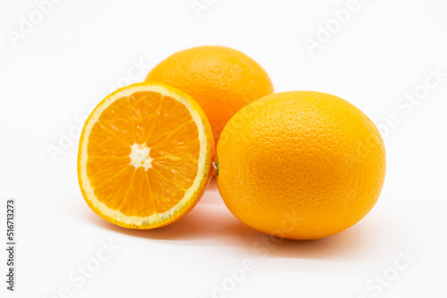 whole and slices orange fruit isolated on white background