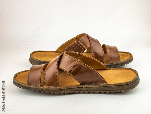 Male brown leather sandals. Close up on the white background.