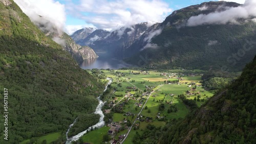 Aerial Flying Through Valley Of Ovre Eidfjord located at the southern end of the lake Eidfjordvatnet. Establishing Shot photo