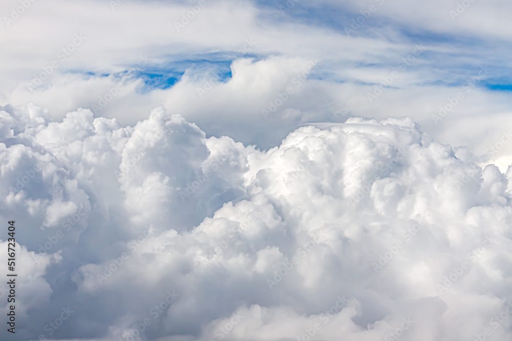 Clouds from above. View from airplane. blue sky view from plane. sky wallpaper with space for your text . Aerial view of the blue sky. High in the Heavens. View from Airplane Window Clouds from above. View from airplane. blue sky view from plane. sky wallpaper with space for your text . Aerial view of the blue sky. High in the Heavens. View from Airplane Window