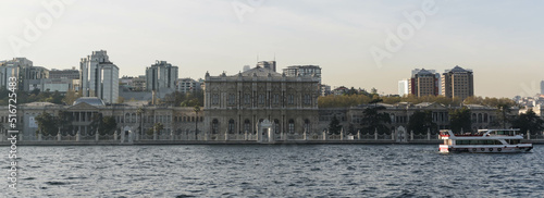 Istanbul city, Turkey - April 2022: Beautiful Dolmabahce Palace. View from cruise ship along Bosphorus Strait