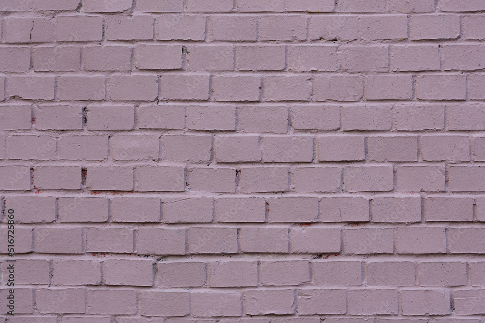 Painted brick wall. The texture of the brickwork. Vintage background with masonry.