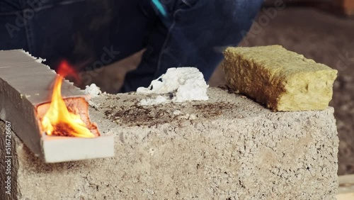 Checking for combustibility of materials for insulating the walls of the house. Burner ignition Extruded polystyrene foam, polystyrene foam, mineral wool. Slow motion
