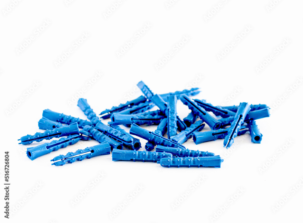 Plastic drawers for screwing screws into concrete or brick isolated on a white background Plastic drawers for screwing screws into concrete or brick isolated on a white background